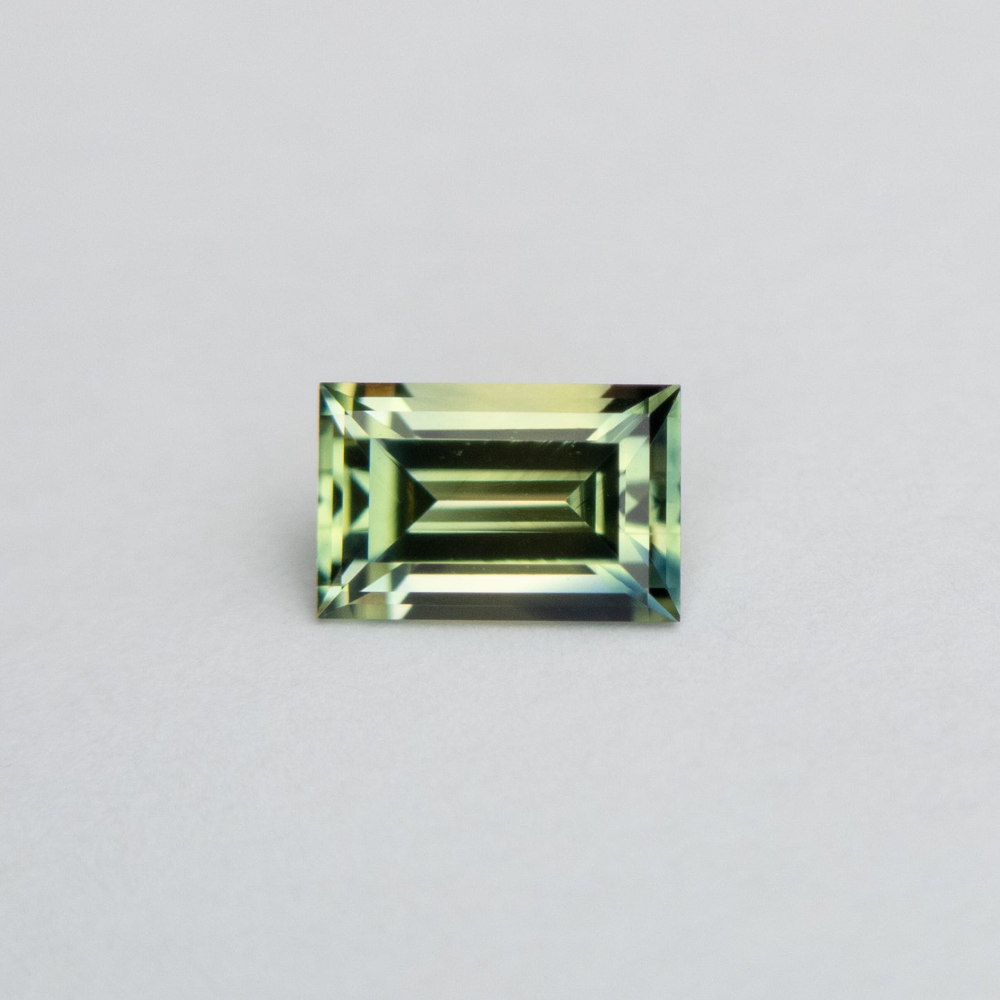 0.59ct 5.79x3.76x2.62mm Parti Blue-Green Step Cut Baguette Sapphire EGEM-63