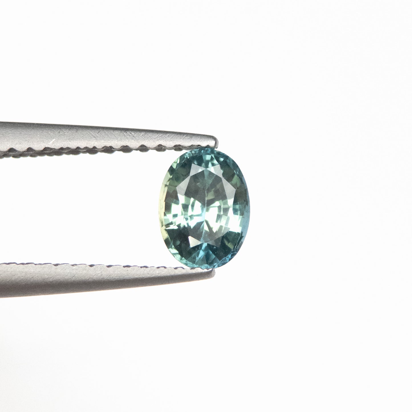 0.74ct 5.95x4.45x3.31mm Light Teal Oval Brilliant Sapphire EGEM-19