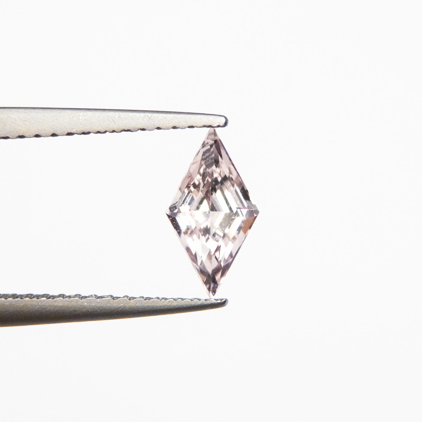 0.88ct 9.25x5.02x3.69mm Peach Step Cut Lozenge Sapphire EGEM-15