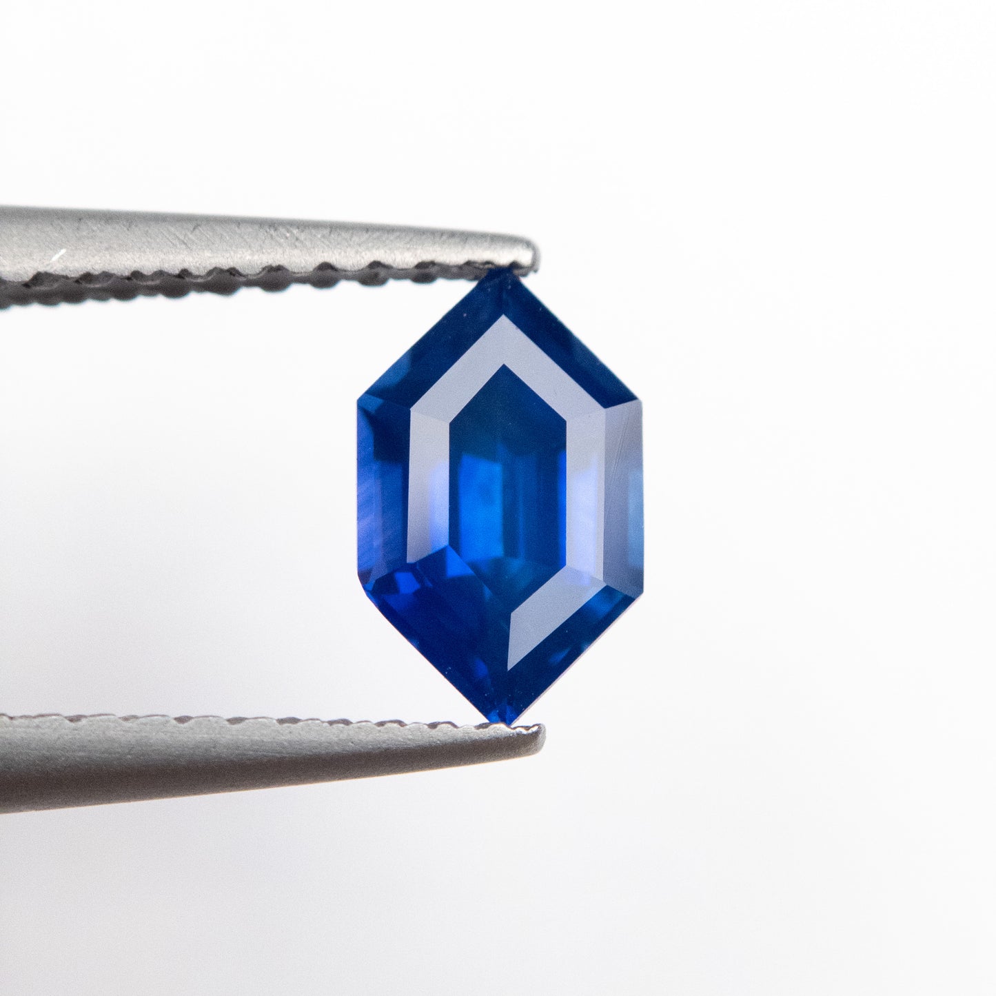 1.01ct 7.84x4.77x3.57mm Blue Hexagon Step Cut Sapphire EGEM-45