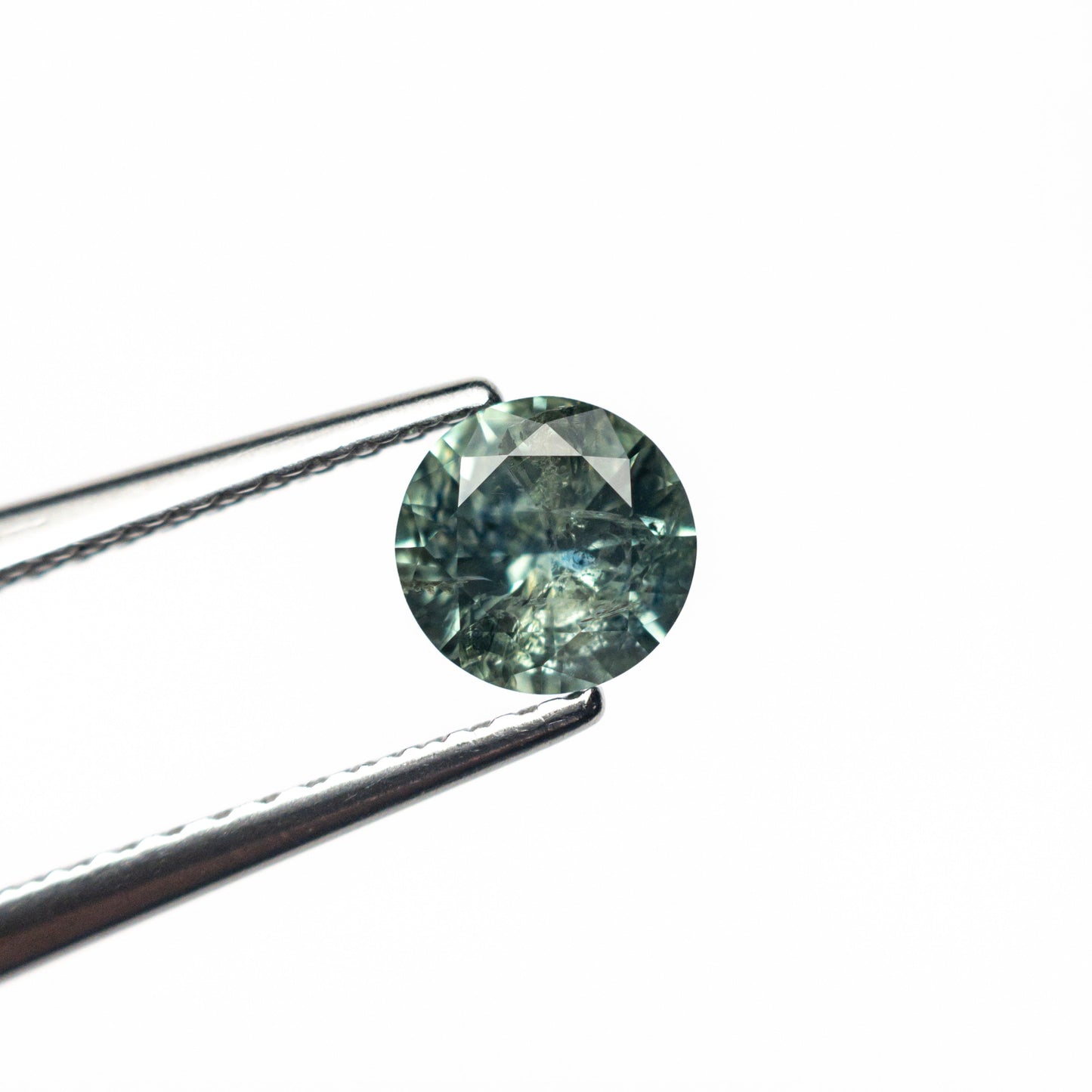 0.59ct 5.17x5.13x3.10mm Round Brilliant Sapphire 26556-21