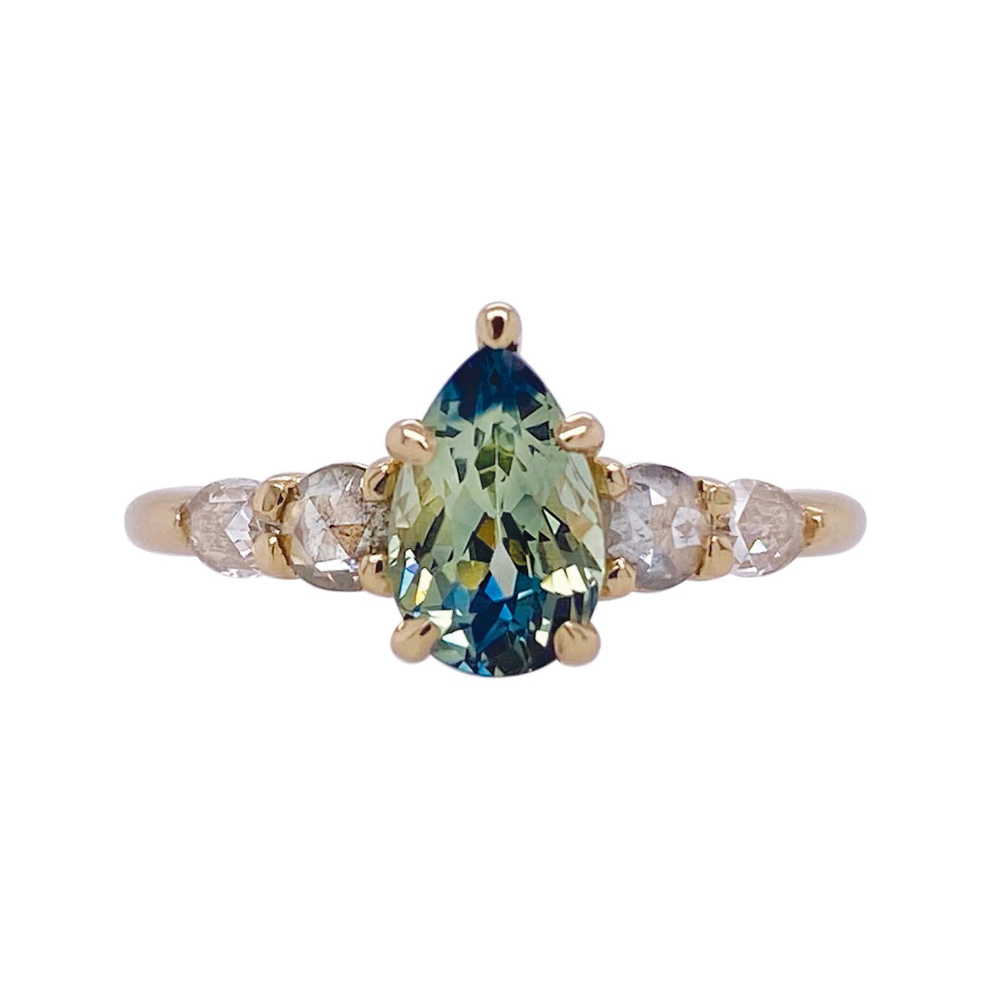Design: Naturally elegant with subtle glitter, this bi-color sapphire and diamond ring were named after a seaside town in my home province of Québec. In this quaint town you can see the unique rock formation of Percé rock off the most eastern point of the Gaspé peninsula. Pairs beautifully with the Gaspé band shown. Details: 14K yellow gold 1.31c Australian bi-color sapphire 0.50c I-J color, salt/pepper, I clarity diamonds Band approx. 1.8mm wide One of a kind Claw settings