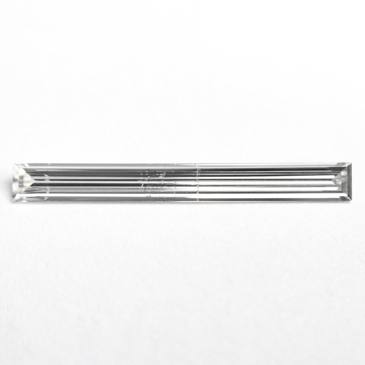 0.52ct 19.44x2.17x1.09mm SI2 E Baguette Step Cut 26545-01