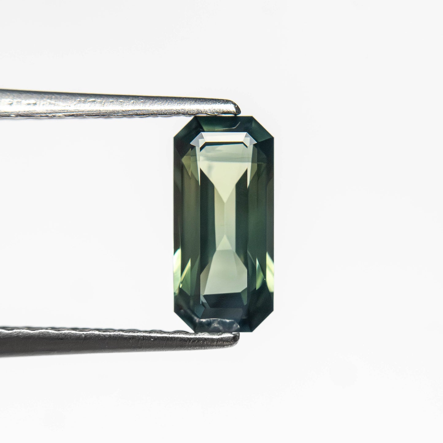 0.71ct 7.78x3.64x2.46mm Cut Corner Rectangle Step Cut Sapphire 27336-53