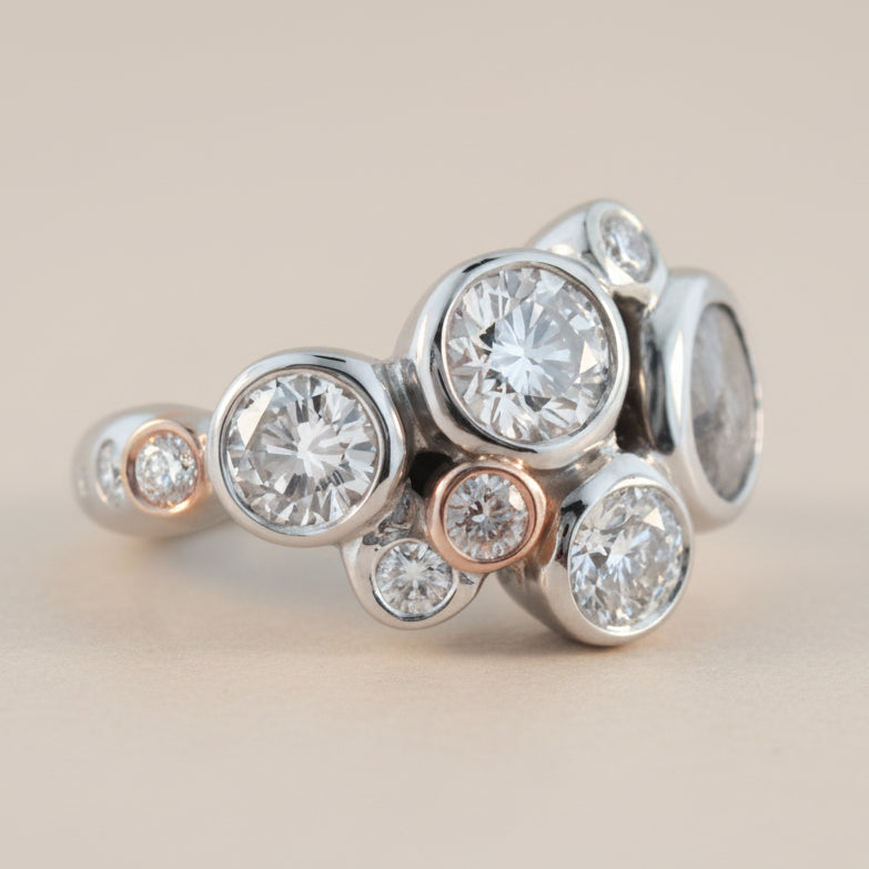 white gold bezel set ring with diamonds