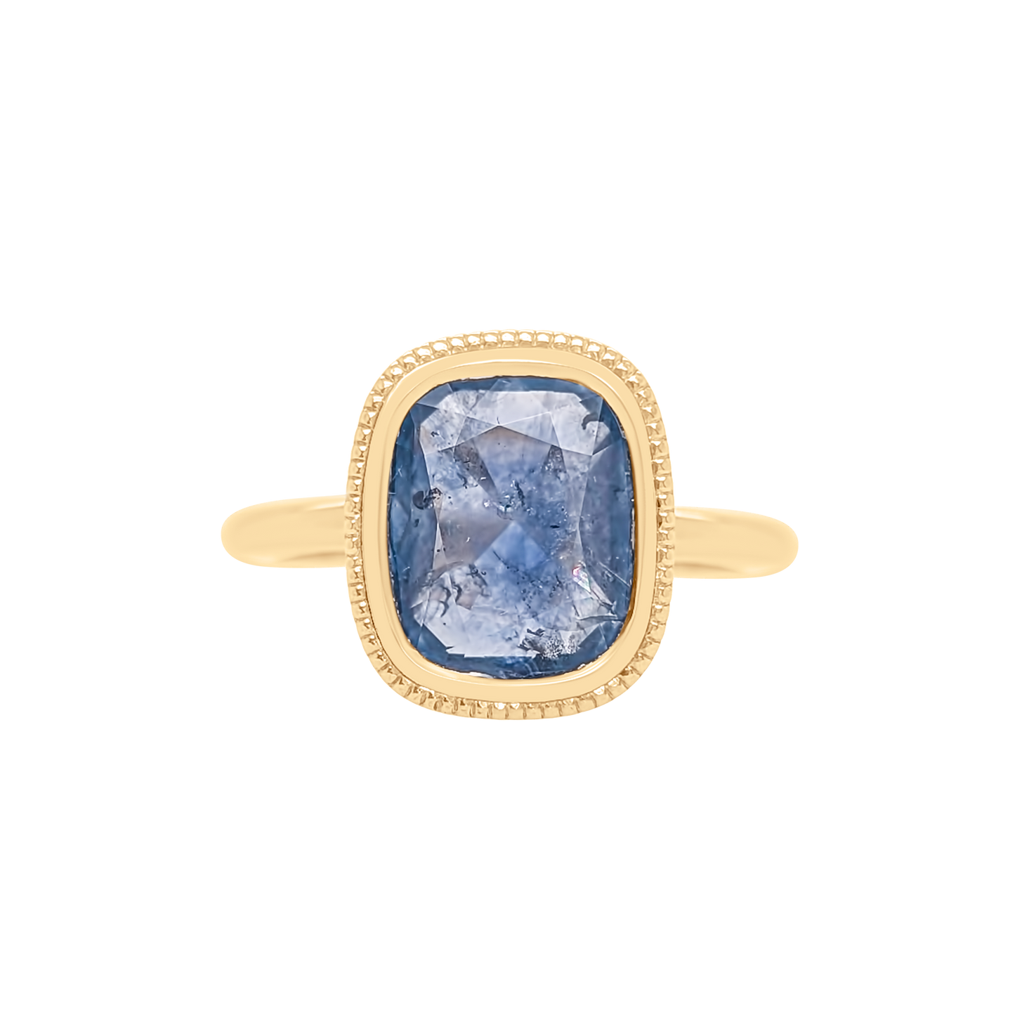 Gold ring with a blue gemstone on a white background