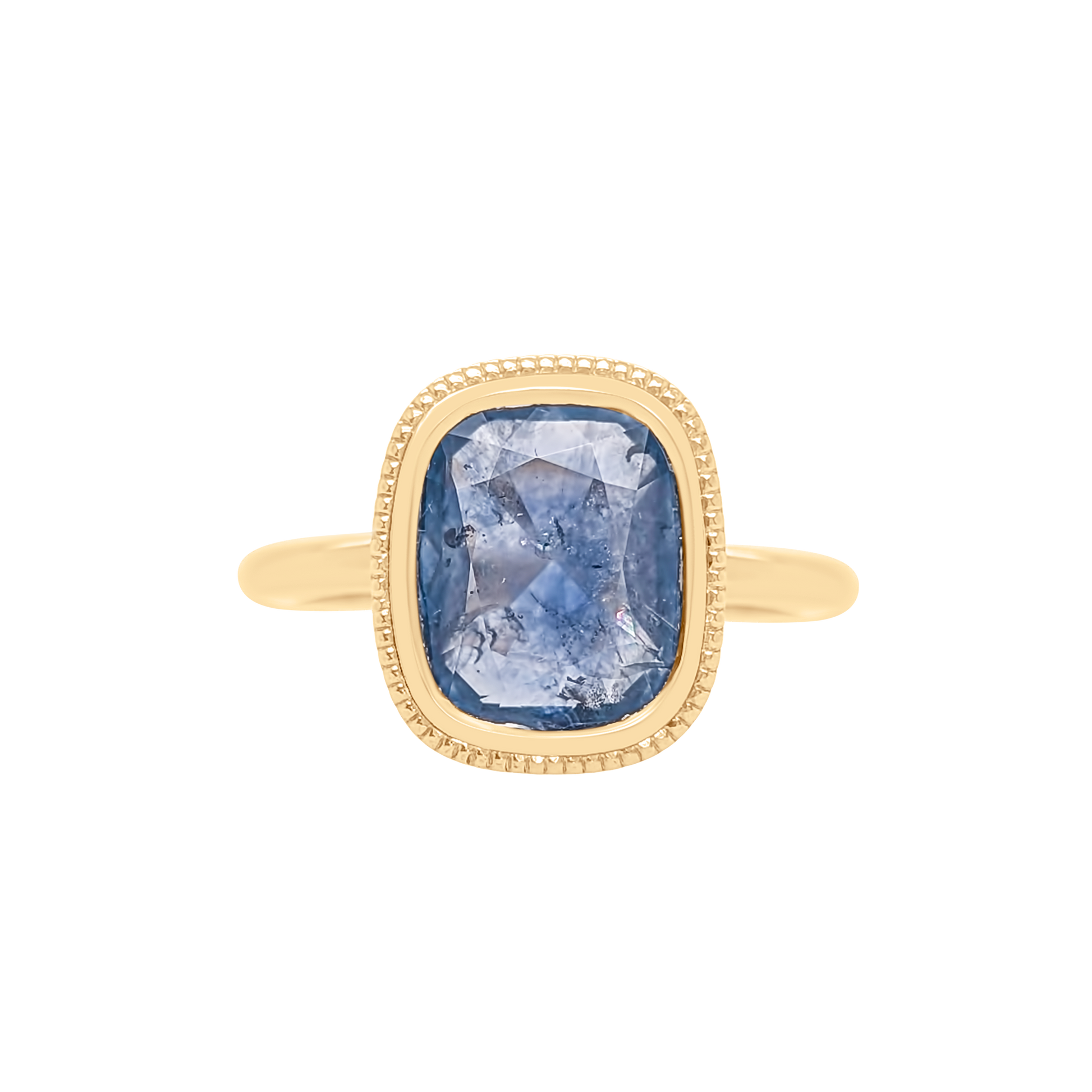 Gold ring with a blue gemstone on a white background