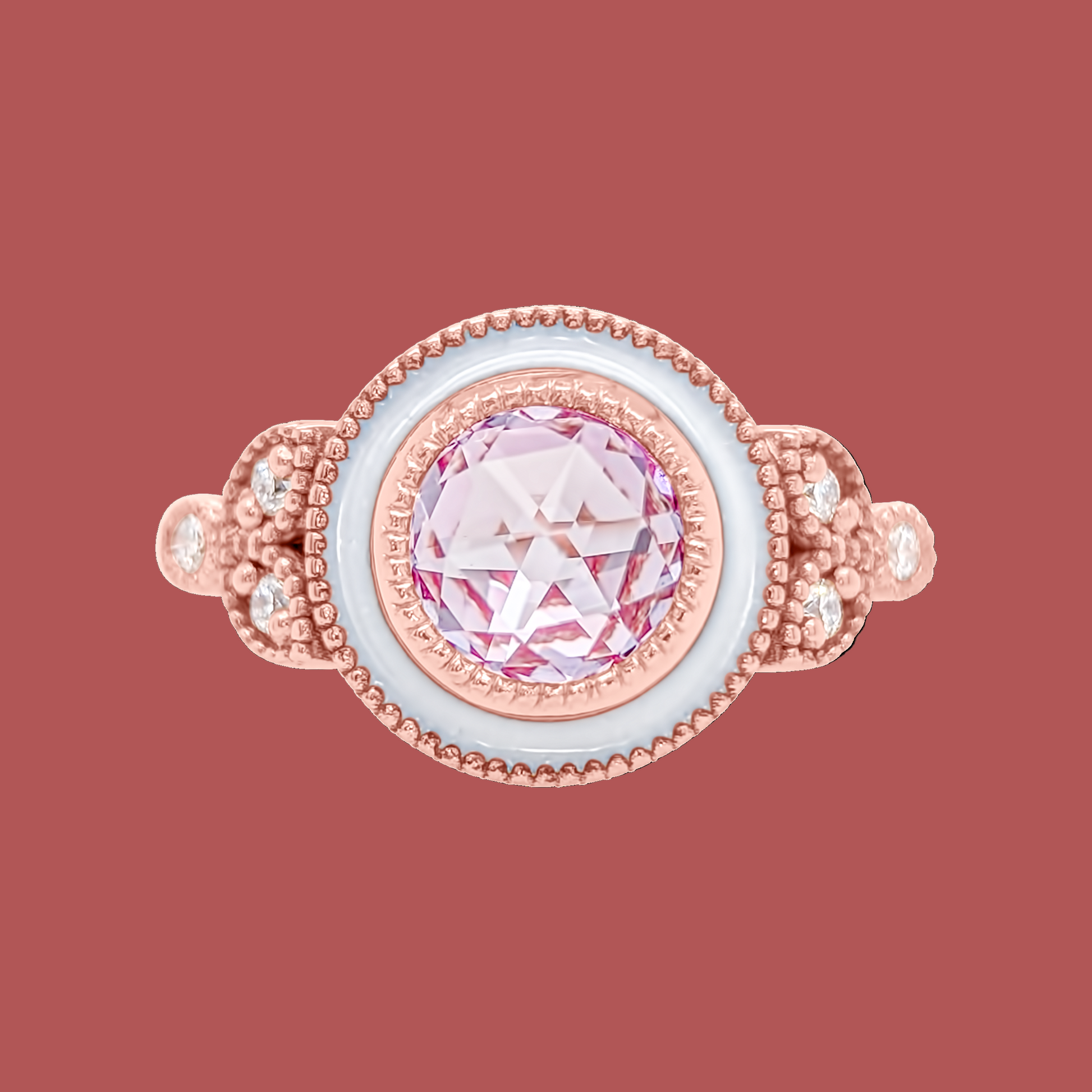 Rose gold ring with a pink gemstone on a white background
