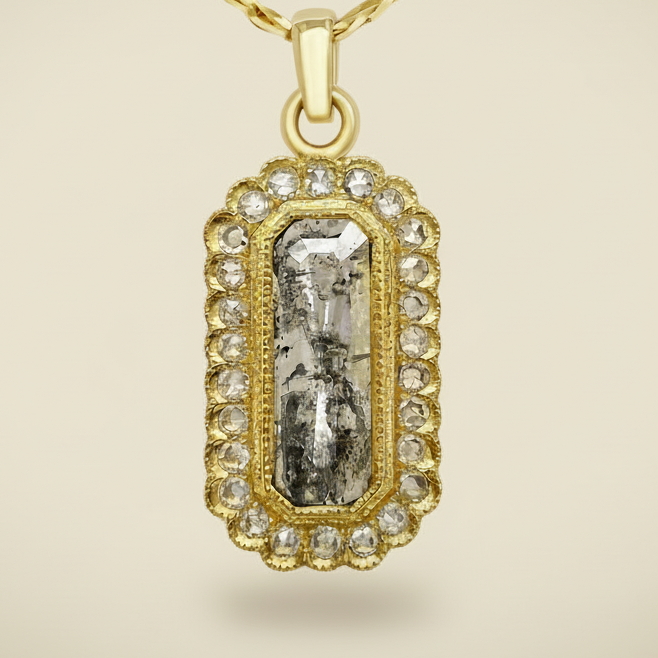 Gold pendant necklace with a central gemstone and diamond accents on a white background